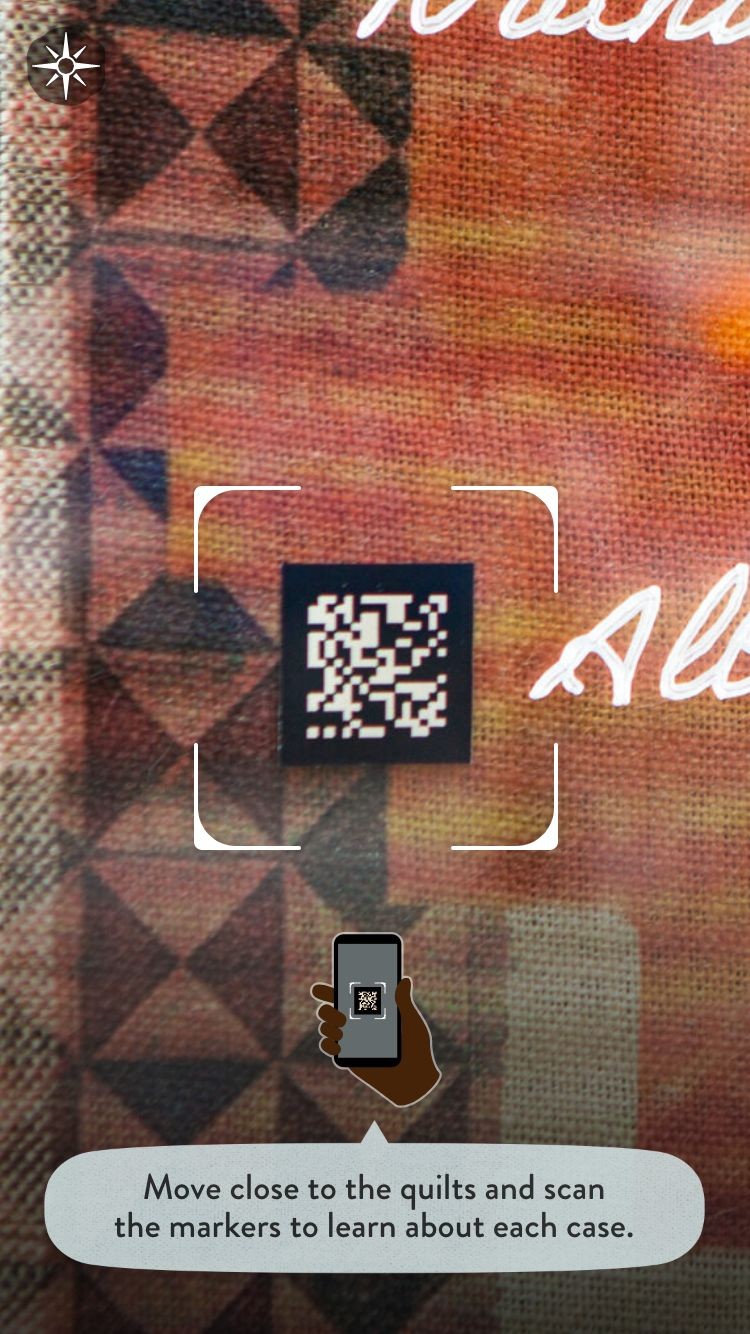 A screen from the Un(re)solved app with an instruction showing how to scan an AR marker.