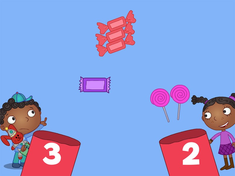 An iPad game screen showing two characters catching candy in baskets with numbers.